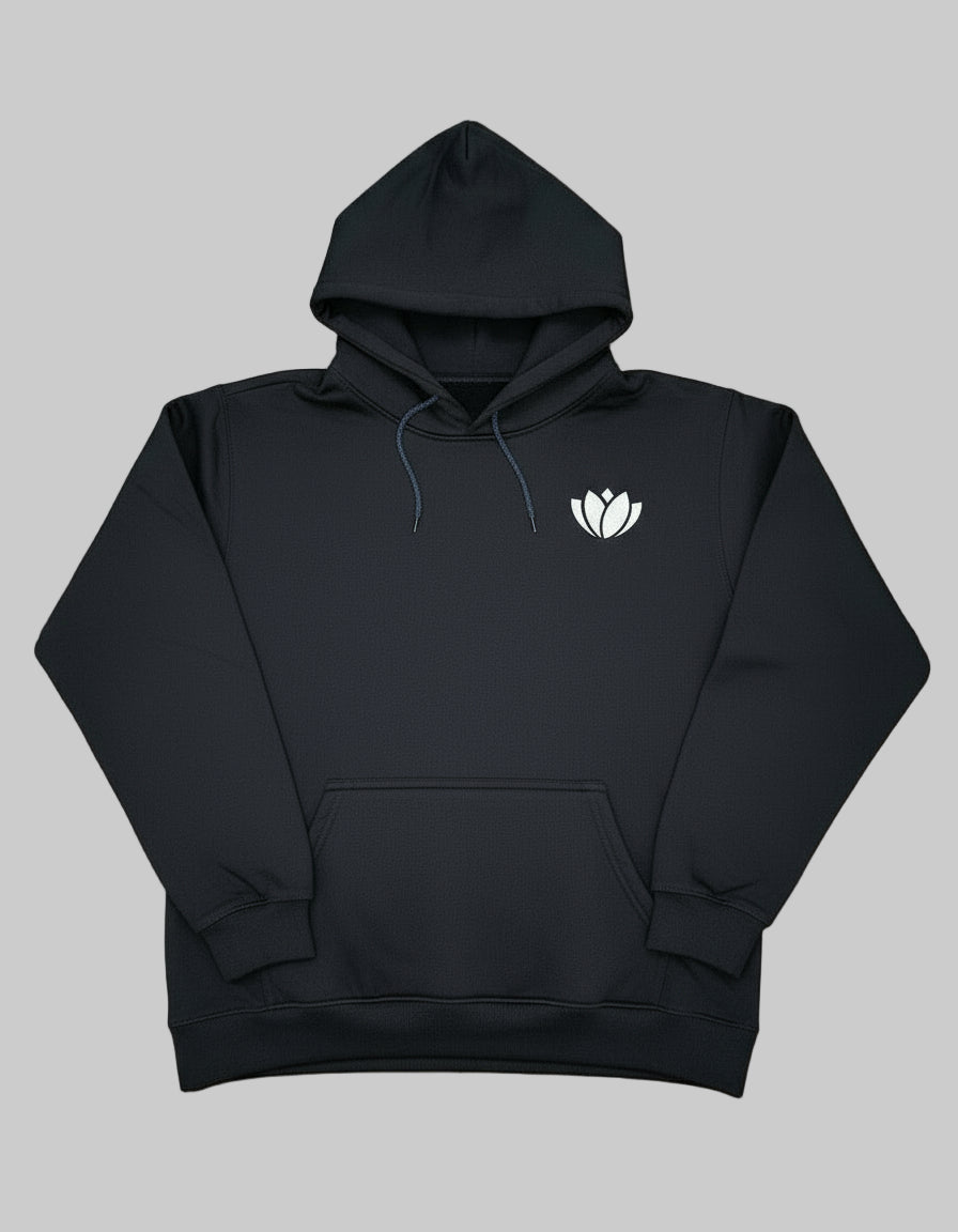 Black hoodie with a white logo on a colorful patterned fabric background